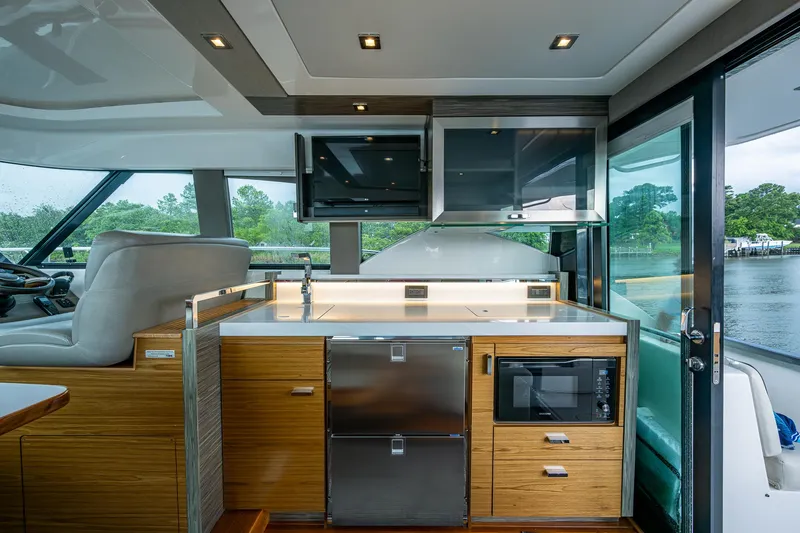  Yacht Photos Pics Interior of 2020 Tiara Yachts C44 Coupe with modern kitchen amenities.