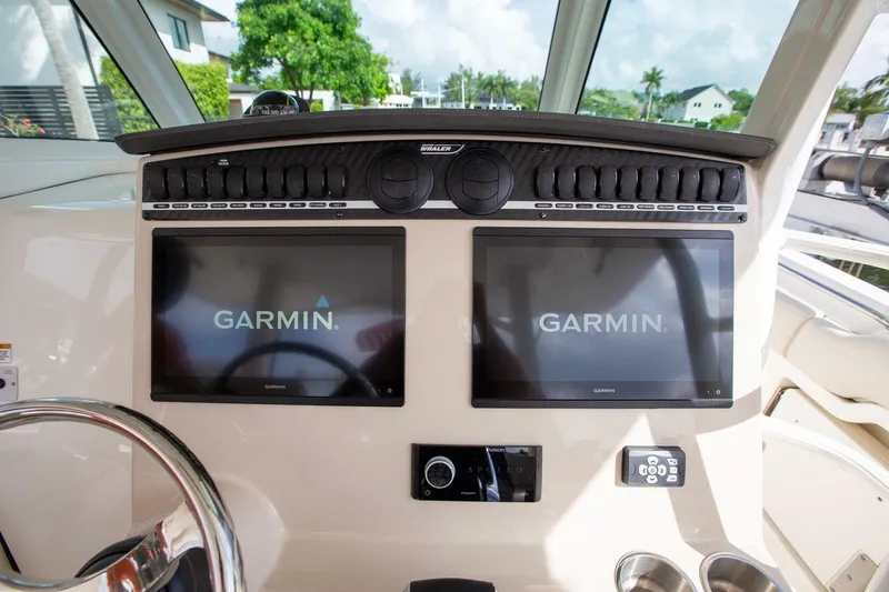 Double Nickel Yacht Photos Pics 2023 Boston Whaler 380 Outrage helm with dual Garmin displays and control panel.