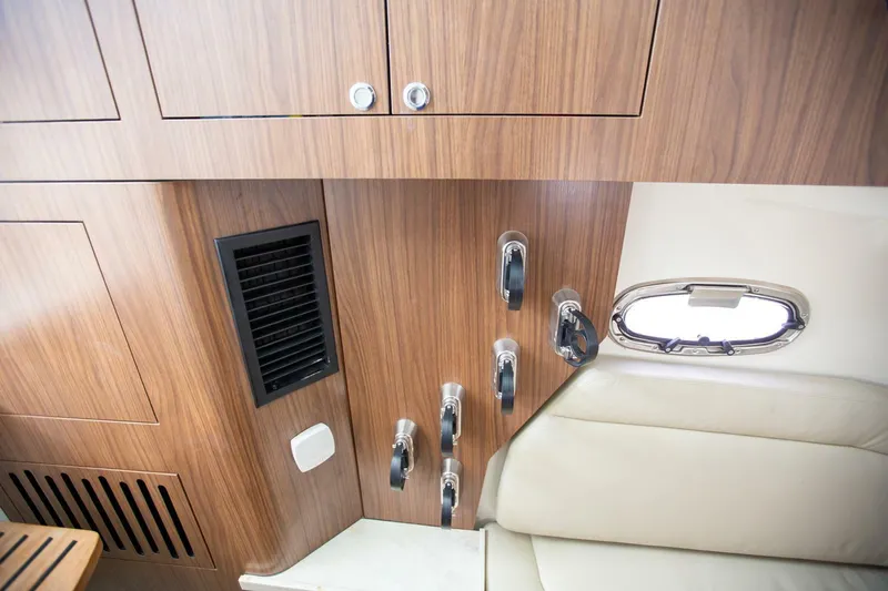 Double Nickel Yacht Photos Pics Interior of 2023 Boston Whaler 380 Outrage, featuring wood paneling and a small window.
