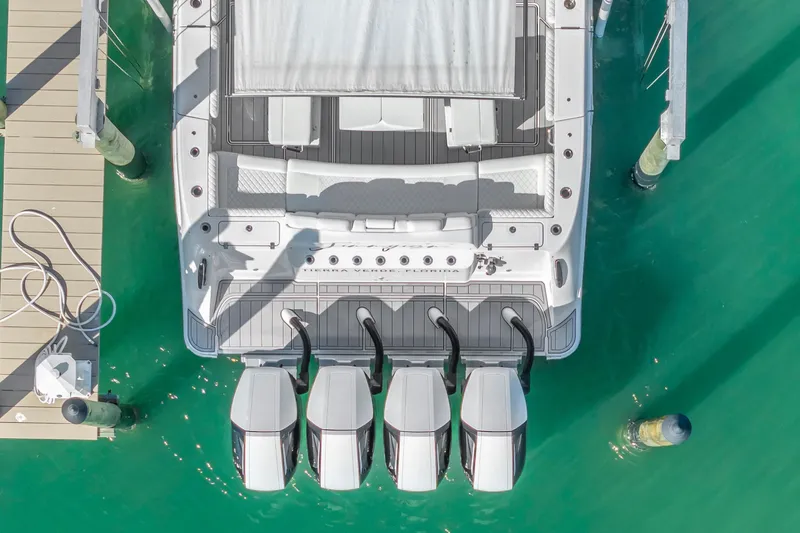 Best Deal Yacht Photos Pics Aerial view of 2023 HCB 53 Suenos RXV boat docked with four engines.