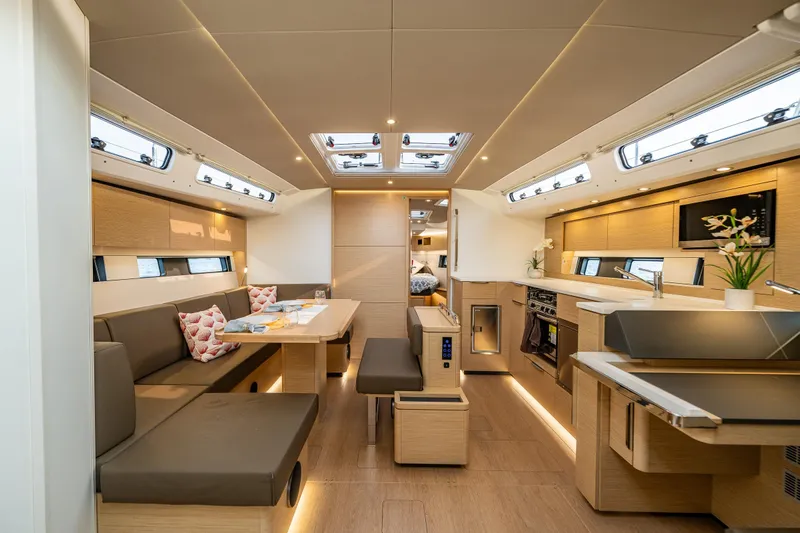 San-197 Yacht Photos Pics Luxurious interior of 2025 Hanse 460 yacht with modern kitchen and seating area.