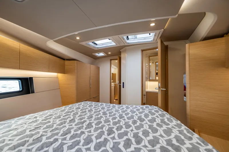 San-197 Yacht Photos Pics Luxurious interior of 2025 Hanse 460 yacht with modern wood finishes and skylights.