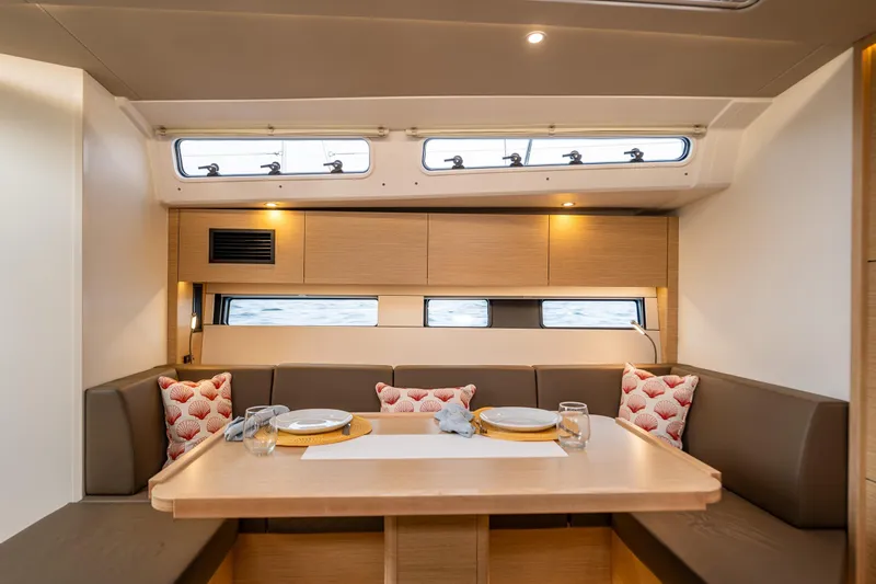 San-197 Yacht Photos Pics Modern interior of 2025 Hanse 460 yacht with elegant dining area and stylish decor.