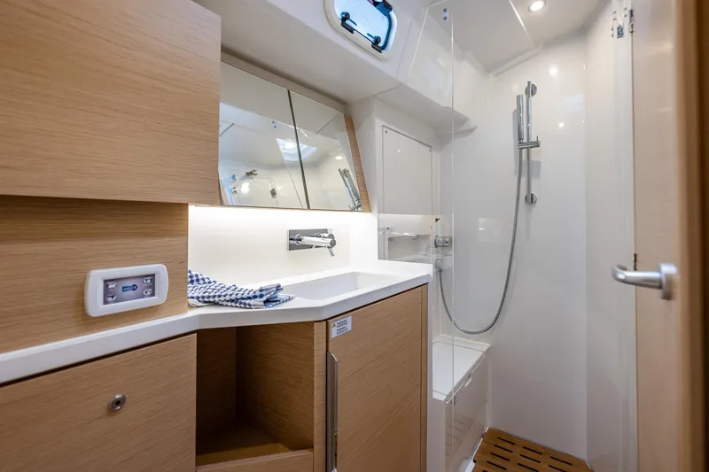 San-197 Yacht Photos Pics Modern bathroom in 2025 Hanse 460 yacht with sleek fixtures and wooden accents.