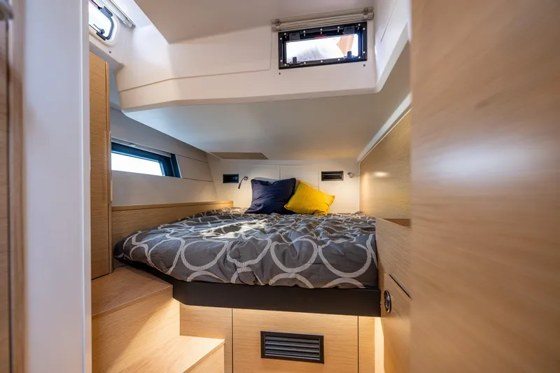 San-197 Yacht Photos Pics 2025 Hanse 460 yacht cabin with cozy bed, modern design, and natural light.