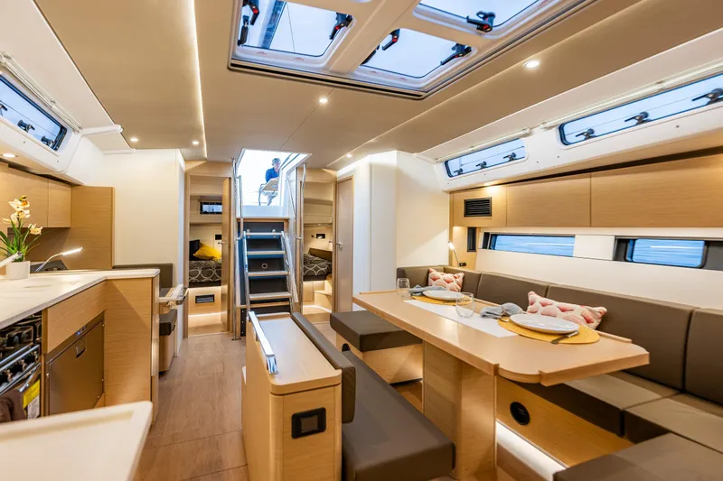 San-197 Yacht Photos Pics Luxurious interior of 2025 Hanse 460 yacht with modern dining and living area.