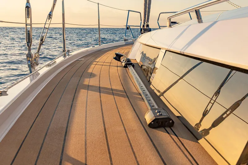 San-197 Yacht Photos Pics Sleek deck of 2025 Hanse 460 yacht with ocean view at sunset.