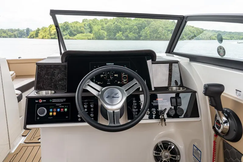  Yacht Photos Pics Manufacturer Provided Image: 2023 Sea Ray SDX 290 boat dashboard with steering wheel and control panel.