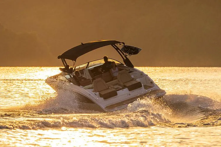  Yacht Photos Pics Manufacturer Provided Image: 2023 Sea Ray SDX 290 boat cruising at sunset on a lake.