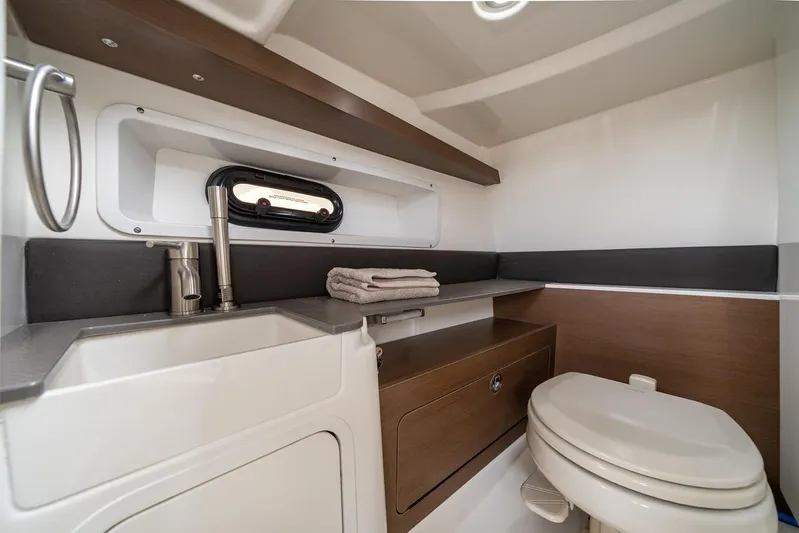 Yacht Photos Pics Manufacturer Provided Image: 2023 Sea Ray SDX 290 boat bathroom with sink, toilet, and storage.
