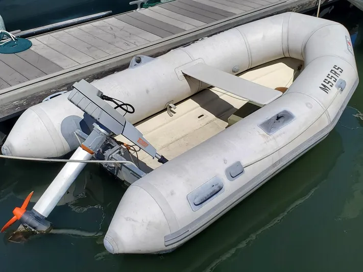 Puffin Yacht Photos Pics Inflatable boat with motor, docked on water; Legacy 32 model, 2008.