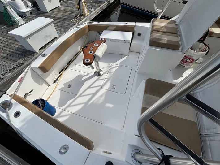 Sawbones Yacht Photos Pics 2011 Luhrs 37 Canyon IPS boat deck with seating and fishing rod holders.