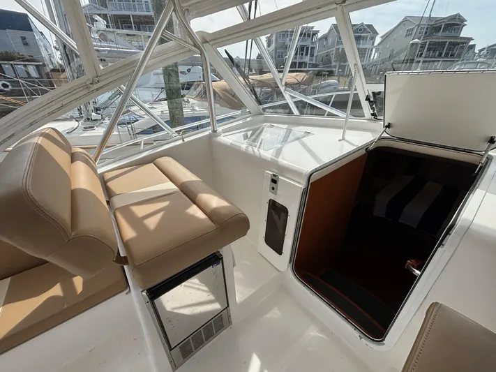 Sawbones Yacht Photos Pics 2011 Luhrs 37 Canyon IPS boat interior with tan seating and open cabin hatch.