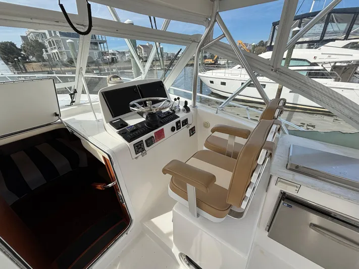 Sawbones Yacht Photos Pics 2011 Luhrs 37 Canyon IPS helm with dual seats and navigation controls.