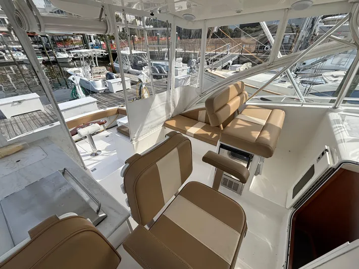 Sawbones Yacht Photos Pics 2011 Luhrs 37 Canyon IPS boat interior with tan seating and marina view.