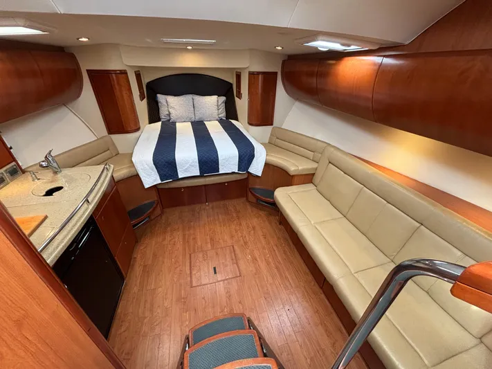 Sawbones Yacht Photos Pics Luxurious interior of 2011 Luhrs 37 Canyon IPS yacht with bed, seating, and kitchenette.