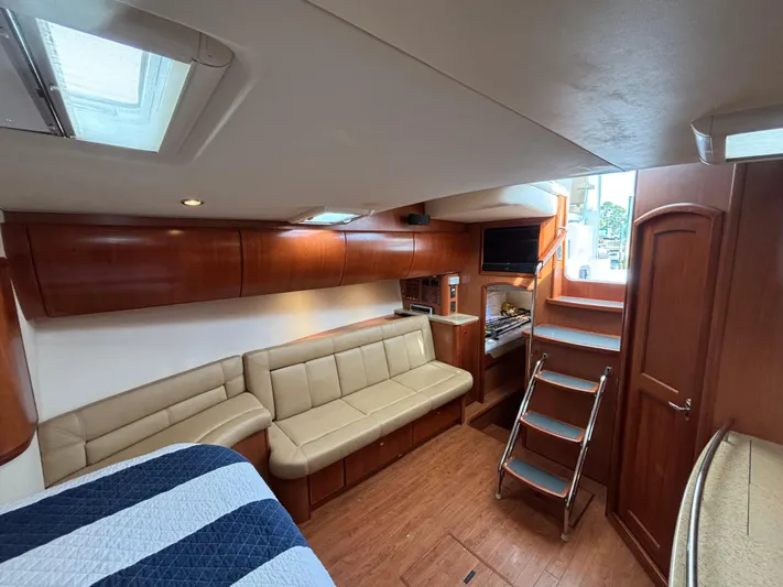 Sawbones Yacht Photos Pics Interior of 2011 Luhrs 37 Canyon IPS yacht with leather seating and wooden finishes.