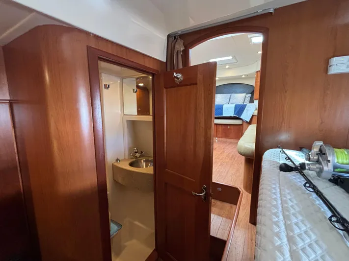 Sawbones Yacht Photos Pics Interior of 2011 Luhrs 37 Canyon IPS boat, featuring wood paneling and compact bathroom.