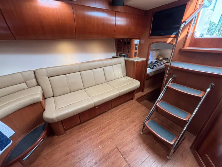 Sawbones Yacht Photos Pics Interior of 2011 Luhrs 37 Canyon IPS yacht with leather seating and wooden finishes.