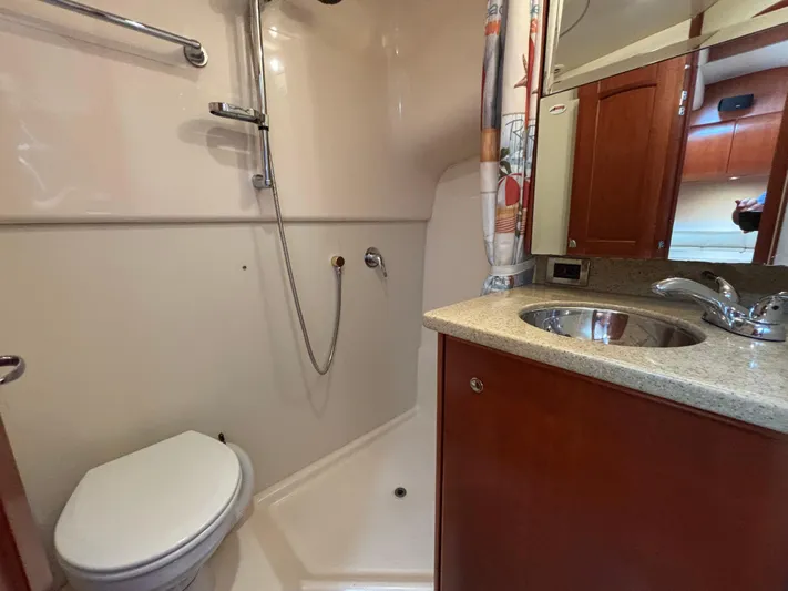 Sawbones Yacht Photos Pics Bathroom interior of 2011 Luhrs 37 Canyon IPS yacht with shower and sink.