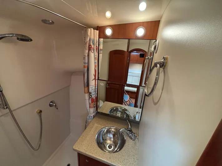 Sawbones Yacht Photos Pics Bathroom interior of 2011 Luhrs 37 Canyon IPS yacht with shower and sink.