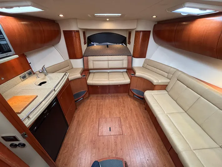 Sawbones Yacht Photos Pics Luxurious interior of 2011 Luhrs 37 Canyon IPS yacht with beige seating and wood finishes.