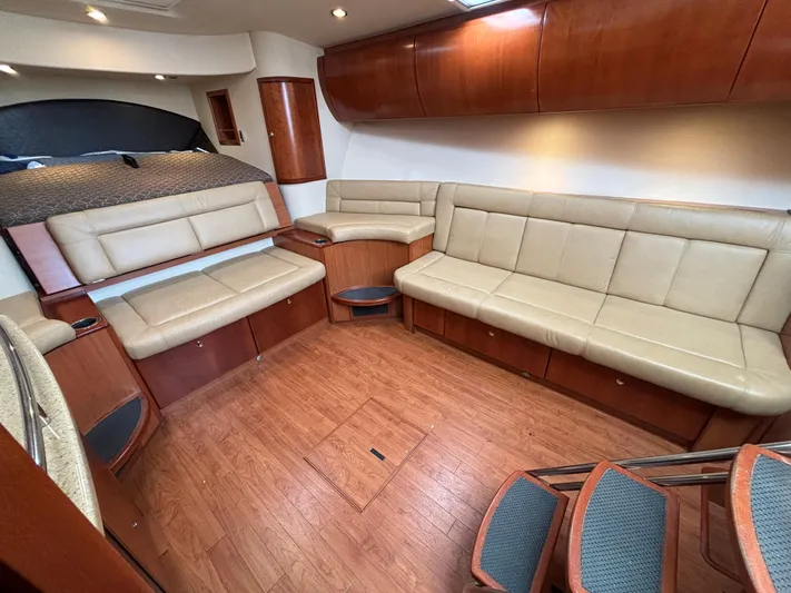 Sawbones Yacht Photos Pics Interior of 2011 Luhrs 37 Canyon IPS yacht with beige leather seating and wood flooring.
