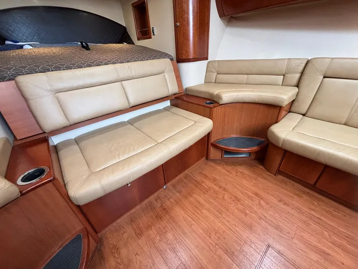 Sawbones Yacht Photos Pics Interior of 2011 Luhrs 37 Canyon IPS yacht with beige leather seating and wood finish.