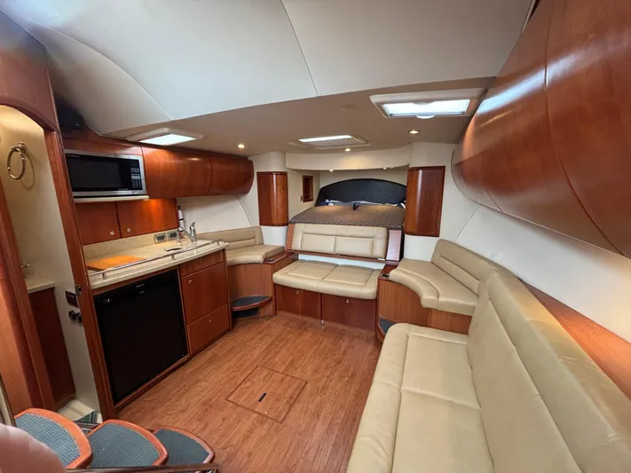 Sawbones Yacht Photos Pics Interior of 2011 Luhrs 37 Canyon IPS yacht with modern kitchen and seating area.