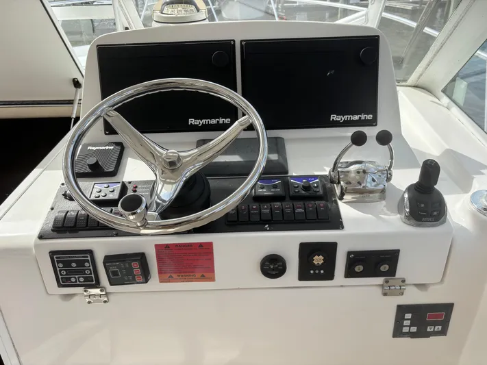 Sawbones Yacht Photos Pics Control panel of 2011 Luhrs 37 Canyon IPS boat with Raymarine electronics.