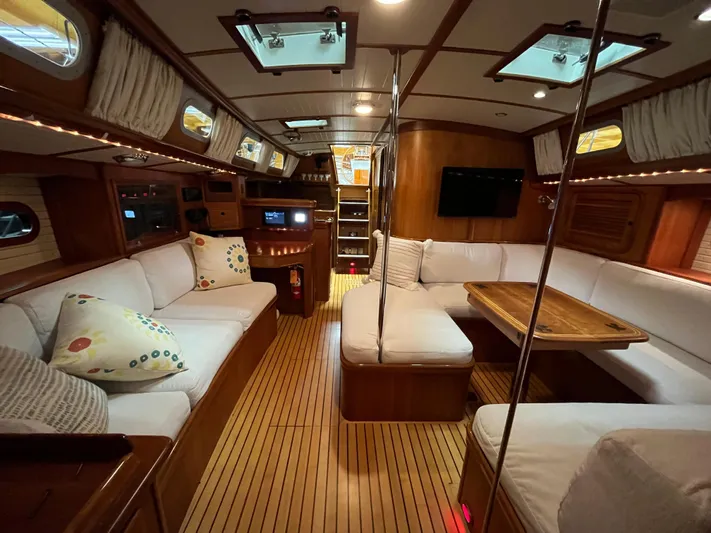 Symphony V Yacht Photos Pics Luxurious interior of a 1999 Hinckley Sou'wester 52 yacht with elegant wood finishes.