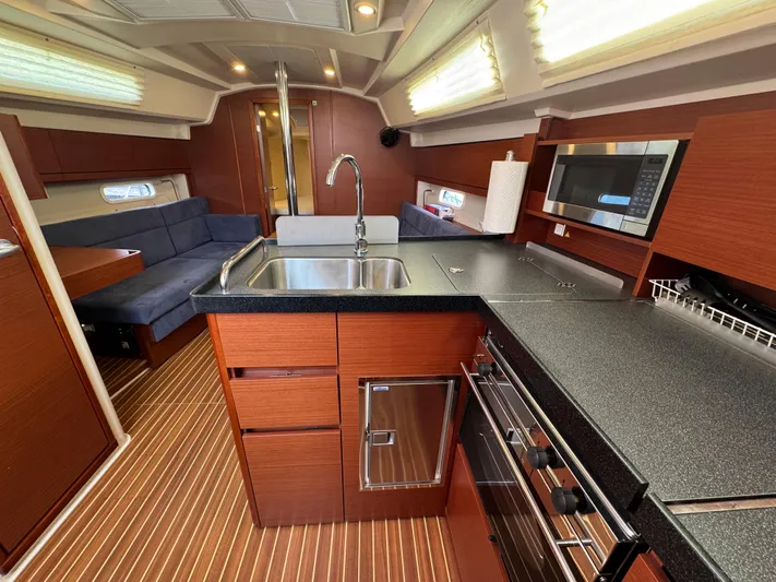 Dreamcatcher Yacht Photos Pics Interior of 2018 Hanse 348 yacht with modern kitchen and seating area.