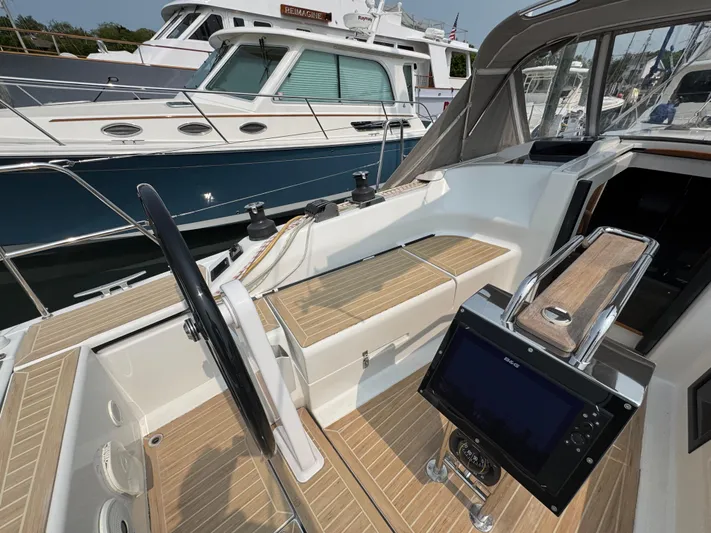 Dreamcatcher Yacht Photos Pics Cockpit of 2018 Hanse 348 yacht with steering wheel and navigation display.