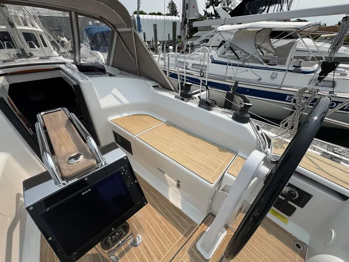 Dreamcatcher Yacht Photos Pics 2018 Hanse 348 yacht cockpit with modern navigation equipment and wooden deck.