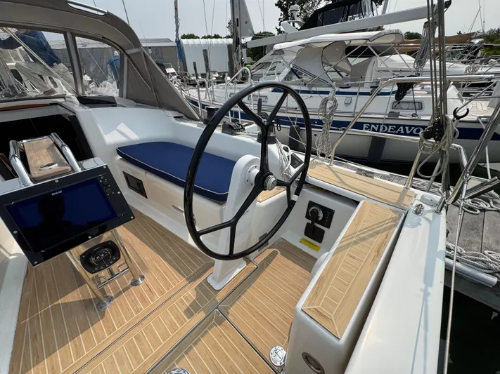 Dreamcatcher Yacht Photos Pics Cockpit of 2018 Hanse 348 sailboat with steering wheel and navigation equipment.