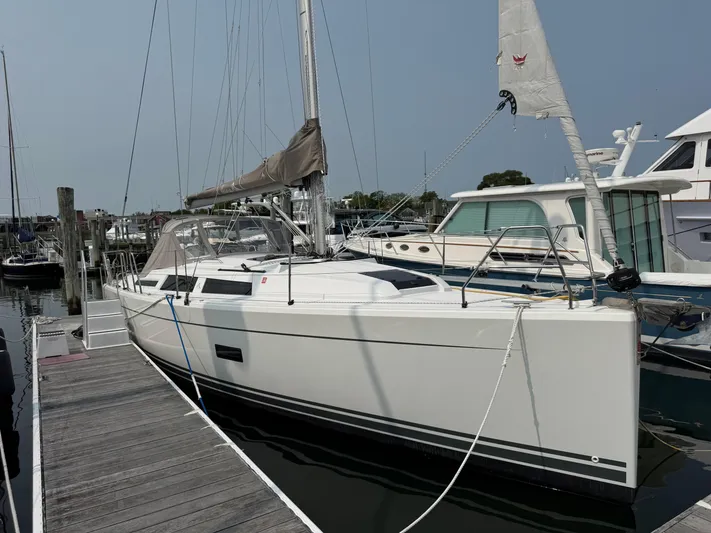 Dreamcatcher Yacht Photos Pics 2018 Hanse 348 sailboat docked at a marina, featuring sleek white design.