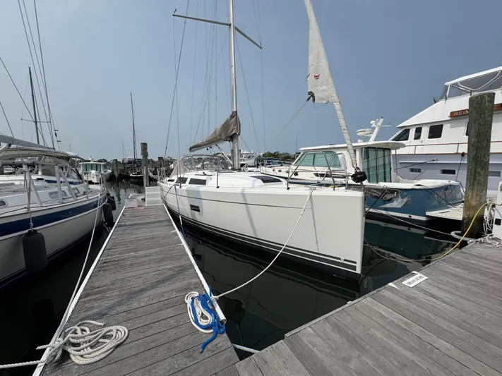 Dreamcatcher Yacht Photos Pics 2018 Hanse 348 sailboat docked at marina, surrounded by other boats.
