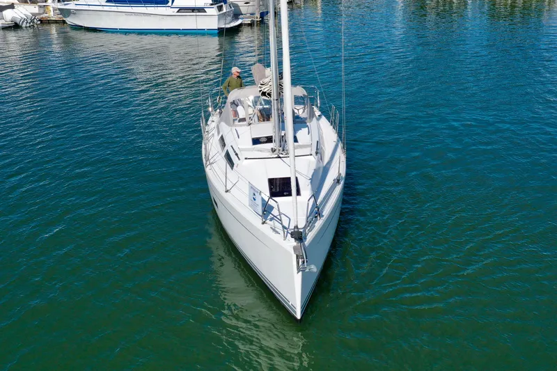 Dreamcatcher Yacht Photos Pics 2018 Hanse 348 sailboat on calm water, viewed from the front.
