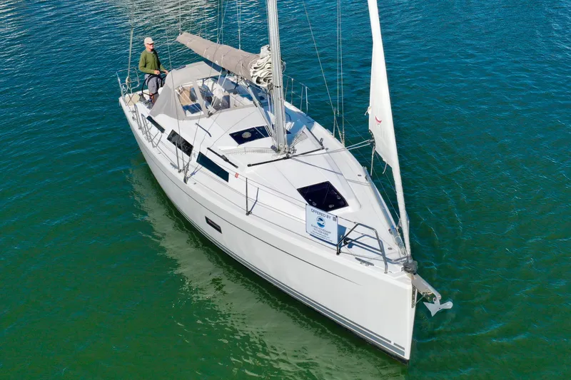Dreamcatcher Yacht Photos Pics 2018 Hanse 348 sailboat on calm water, featuring sleek design and modern amenities.