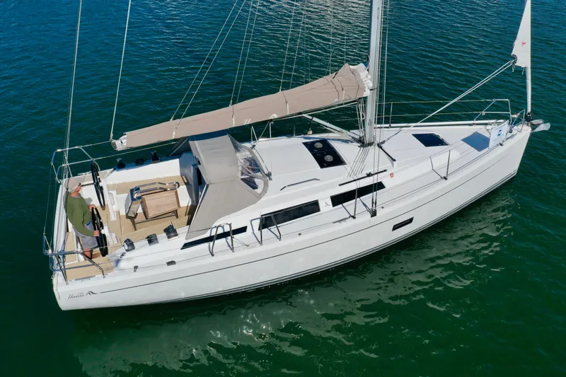 Dreamcatcher Yacht Photos Pics 2018 Hanse 348 sailboat on calm water, featuring sleek design and spacious deck.