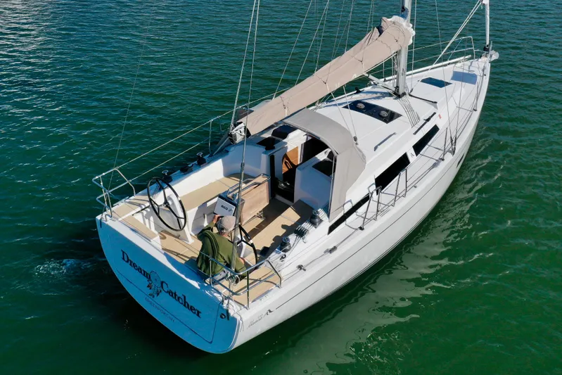 Dreamcatcher Yacht Photos Pics 2018 Hanse 348 sailboat on water, featuring sleek design and spacious deck.