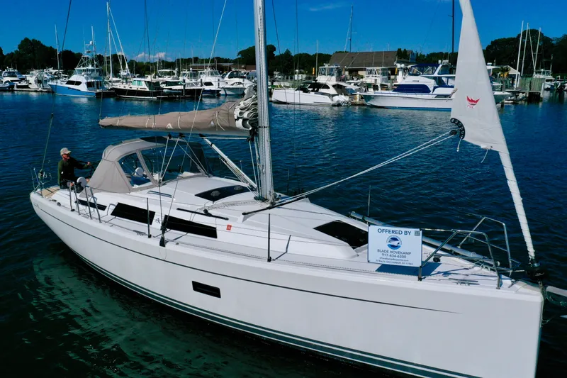 Dreamcatcher Yacht Photos Pics 2018 Hanse 348 sailboat docked in marina, surrounded by other boats.