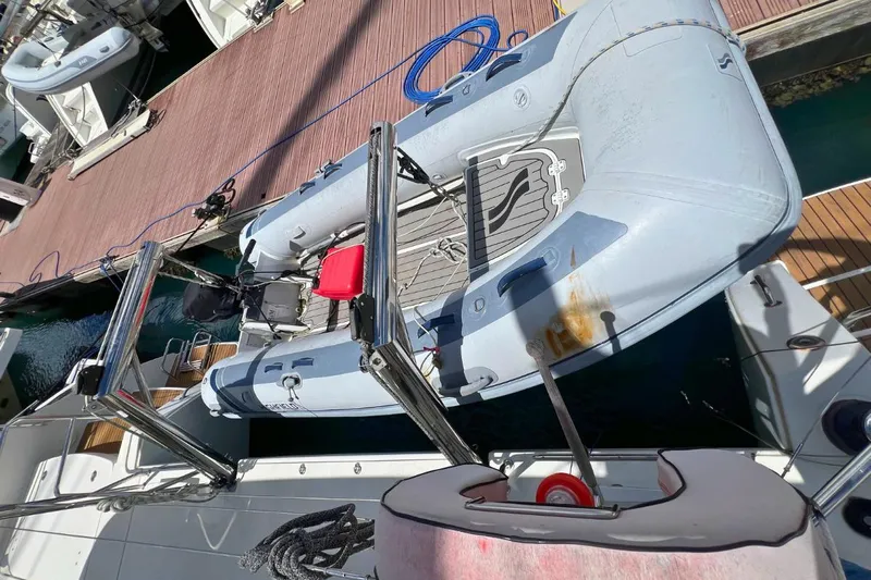 Take It Easy Yacht Photos Pics Inflatable boat on Lagoon 450 F catamaran, docked at marina, 2018 model.