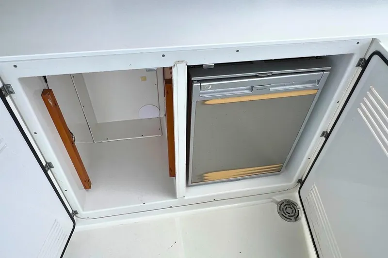 Take It Easy Yacht Photos Pics Interior view of a 2018 Lagoon 450 F yacht's storage and refrigerator compartments.