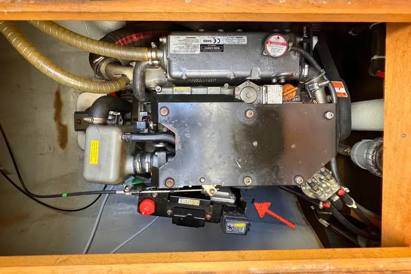 Take It Easy Yacht Photos Pics Engine compartment of a 2018 Lagoon 450 F catamaran, showcasing mechanical components and wiring.