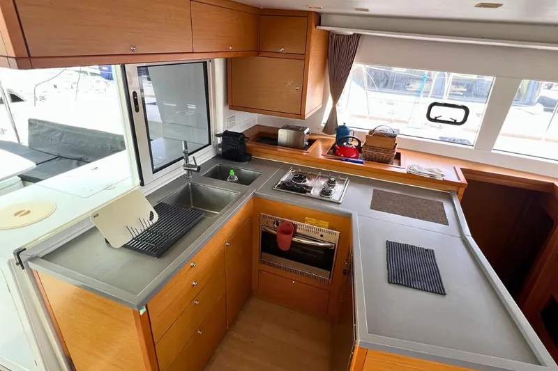 Take It Easy Yacht Photos Pics Modern kitchen interior of 2018 Lagoon 450 F catamaran with ample counter space.