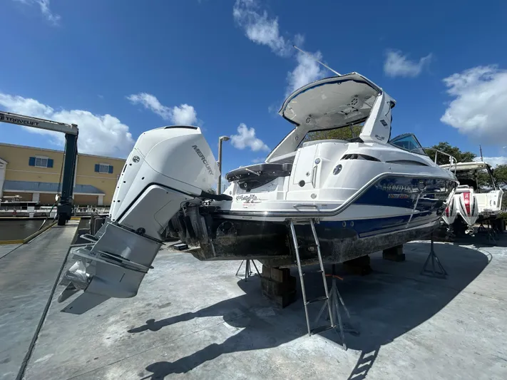 Aguabendita Yacht Photos Pics 2019 Monterey 345 Sport Yacht on dry dock under clear blue sky.