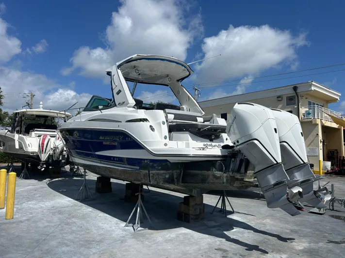 Aguabendita Yacht Photos Pics 2019 Monterey 345 Sport Yacht on stands, outdoor setting, clear sky.