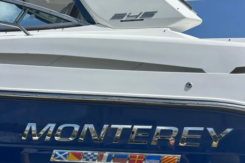 Aguabendita Yacht Photos Pics 2019 Monterey 345 Sport Yacht with nautical flags and sleek design.