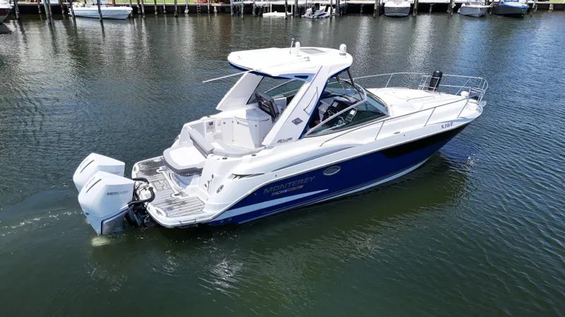 Aguabendita Yacht Photos Pics 2019 Monterey 345 Sport Yacht on calm water, featuring sleek design and powerful engines.